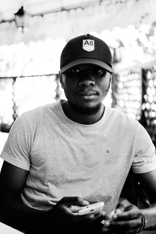 Monochrome Photo of Man Wearing Cap