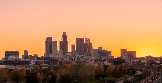 Breathtaking view of the Los Angeles skyline with vibrant sunset hues.
