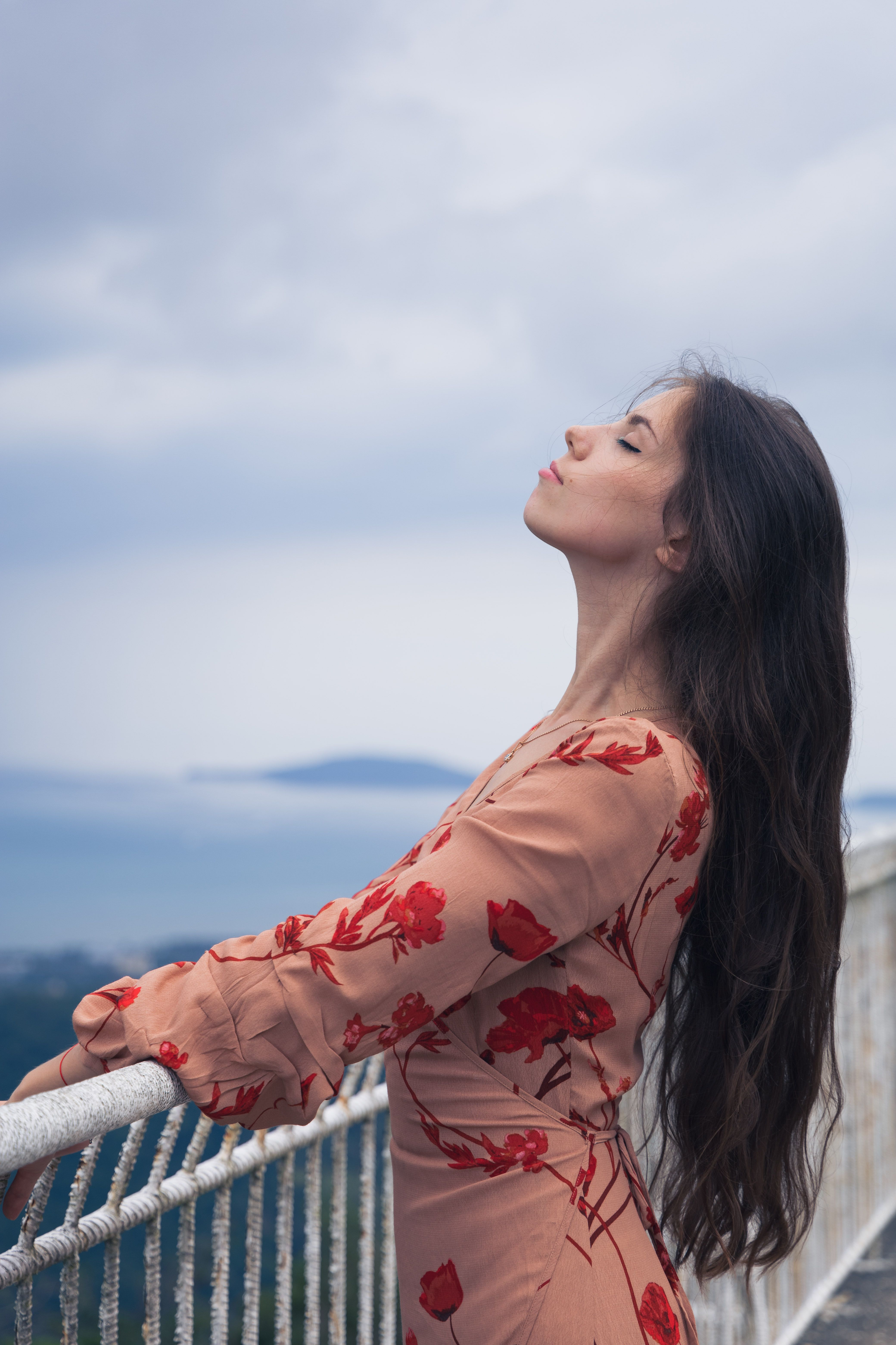 Side View of a Woman Wearing Floral Dress · Free Stock Photo