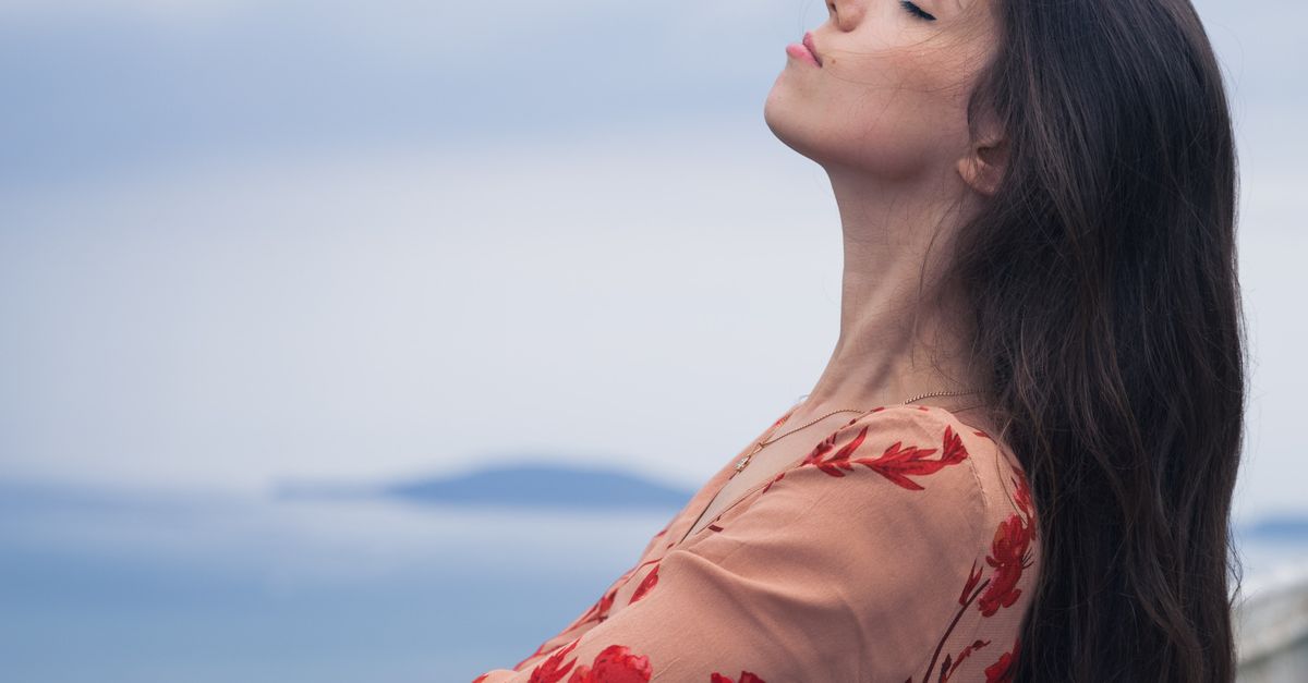 Womanly View Side View of a Woman Wearing Floral Dress · Free Stock Photo