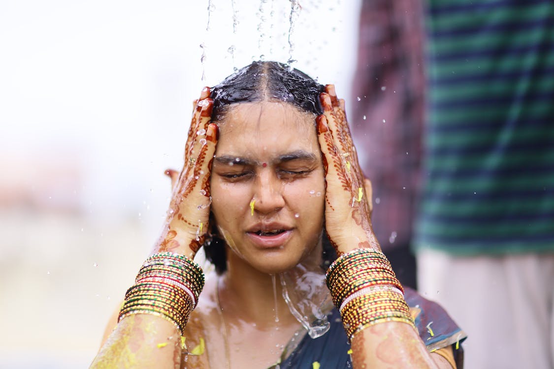 Woman Taking Shower While Wearing Sari Dress