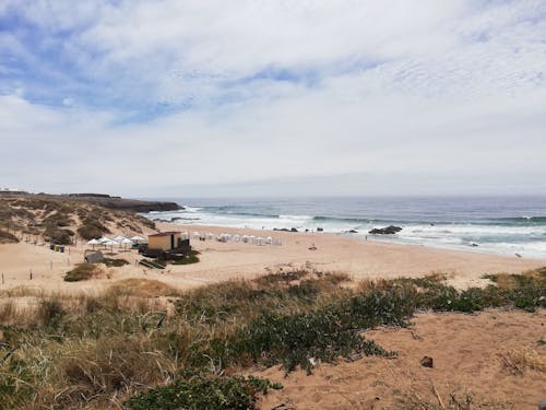 Beach under the Cloudy Sky