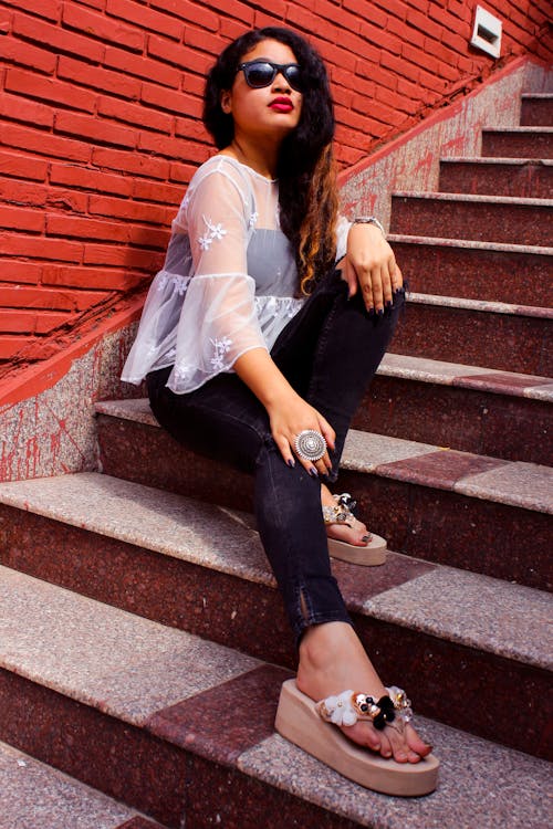 Free Photo of Woman Sitting On Staircase Stock Photo