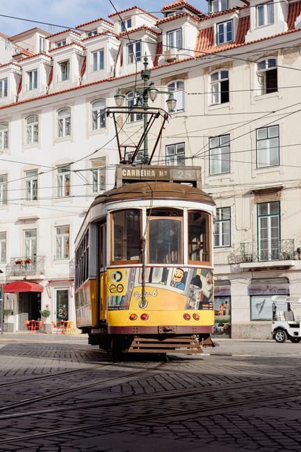 Vintage tram in the heart of Lisbon, capturing the essence of Portuguese urban life.