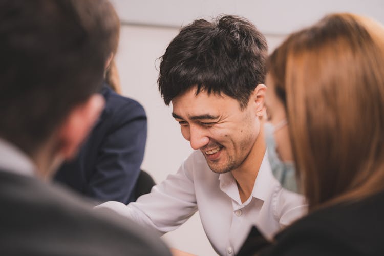 A Group Of People In A Meeting