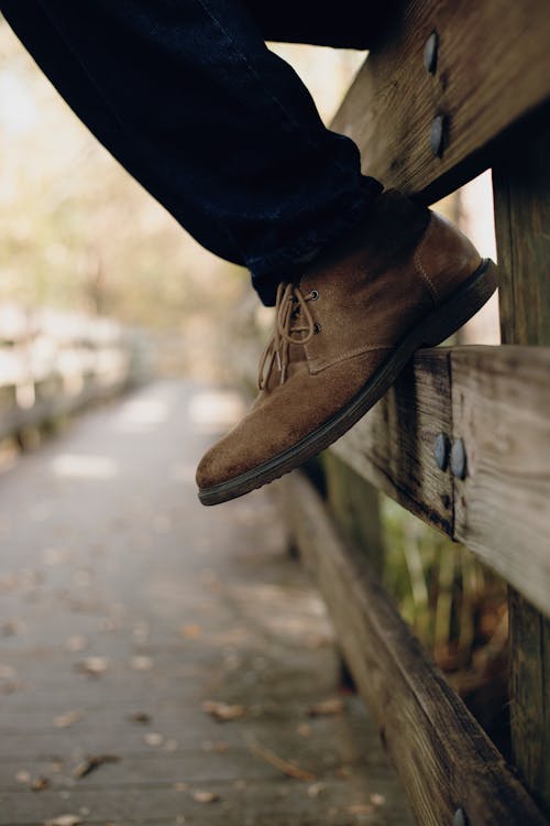 Selective Focus Photo of Brown Boots