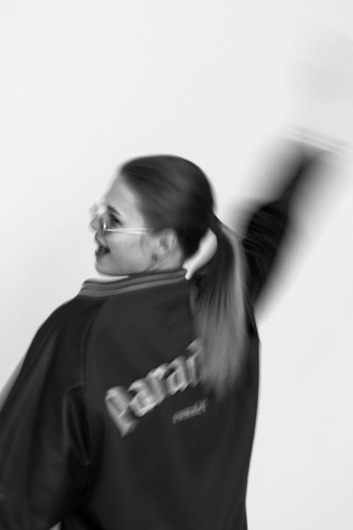 Grayscale Photo of Woman in Ponytail 