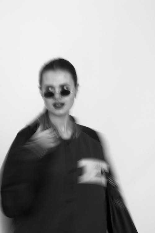 Blurry Photograph of a Woman with Sunglasses