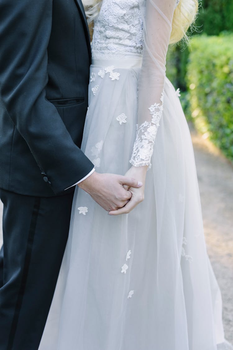 Newlywed Couple Holding Hands