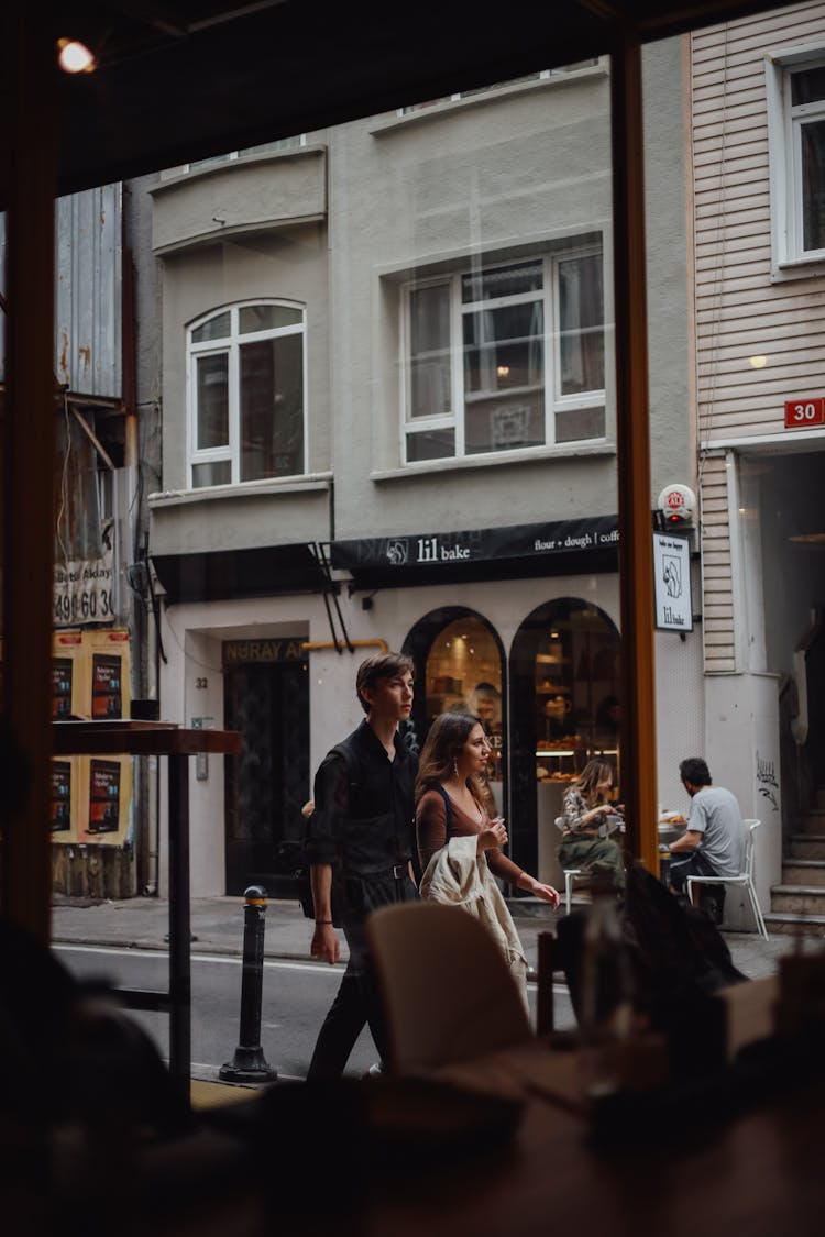 Man And Woman Walking On The Street