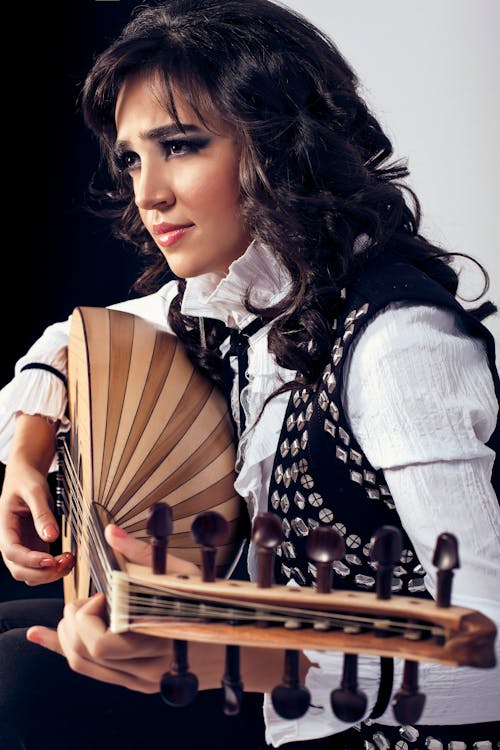 Woman Playing Traditional Guitar
