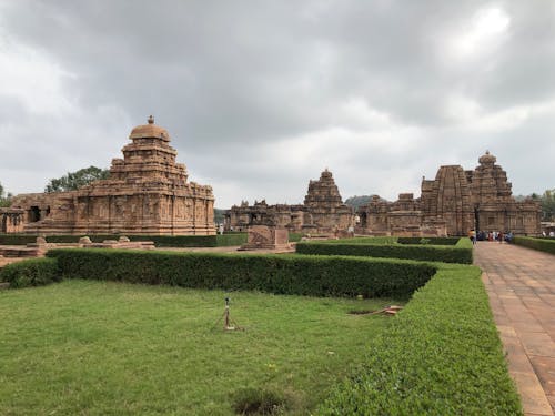 Free Tourists Visiting the Ancient Sir Virupaksha Hindu Temple in Pattadakal India Stock Photo