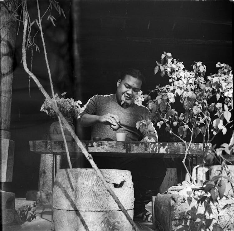 A Man Pouring Tea In The Cup