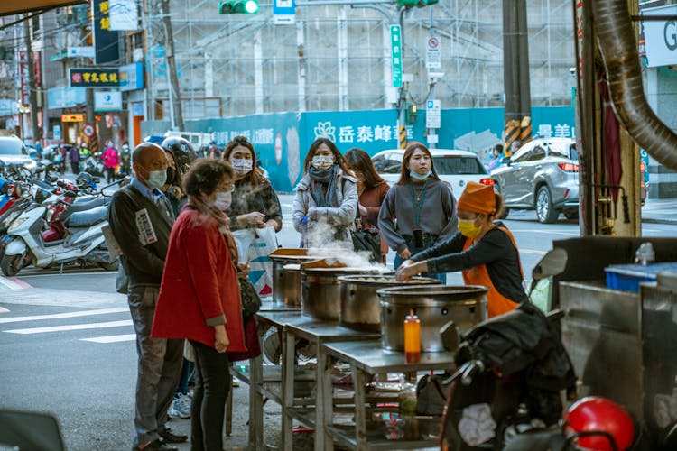 People Buying A Street Food