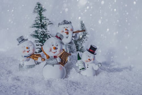 Snowmen Figurines Around a Tree