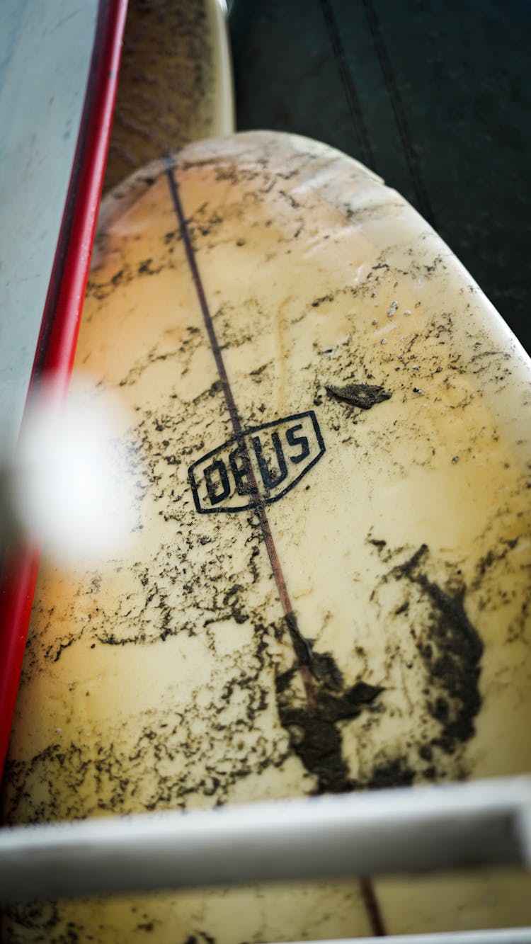 A Close-Up Shot Of A Dirty Surfboard