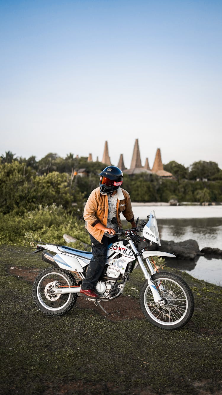 Man On Motorbike Near Water