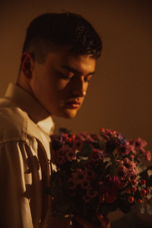 Young Man Holding a Flower Bouquet