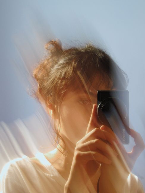 Blurred motion portrait of a woman photographing with an artistic effect in Salvador, Brazil.