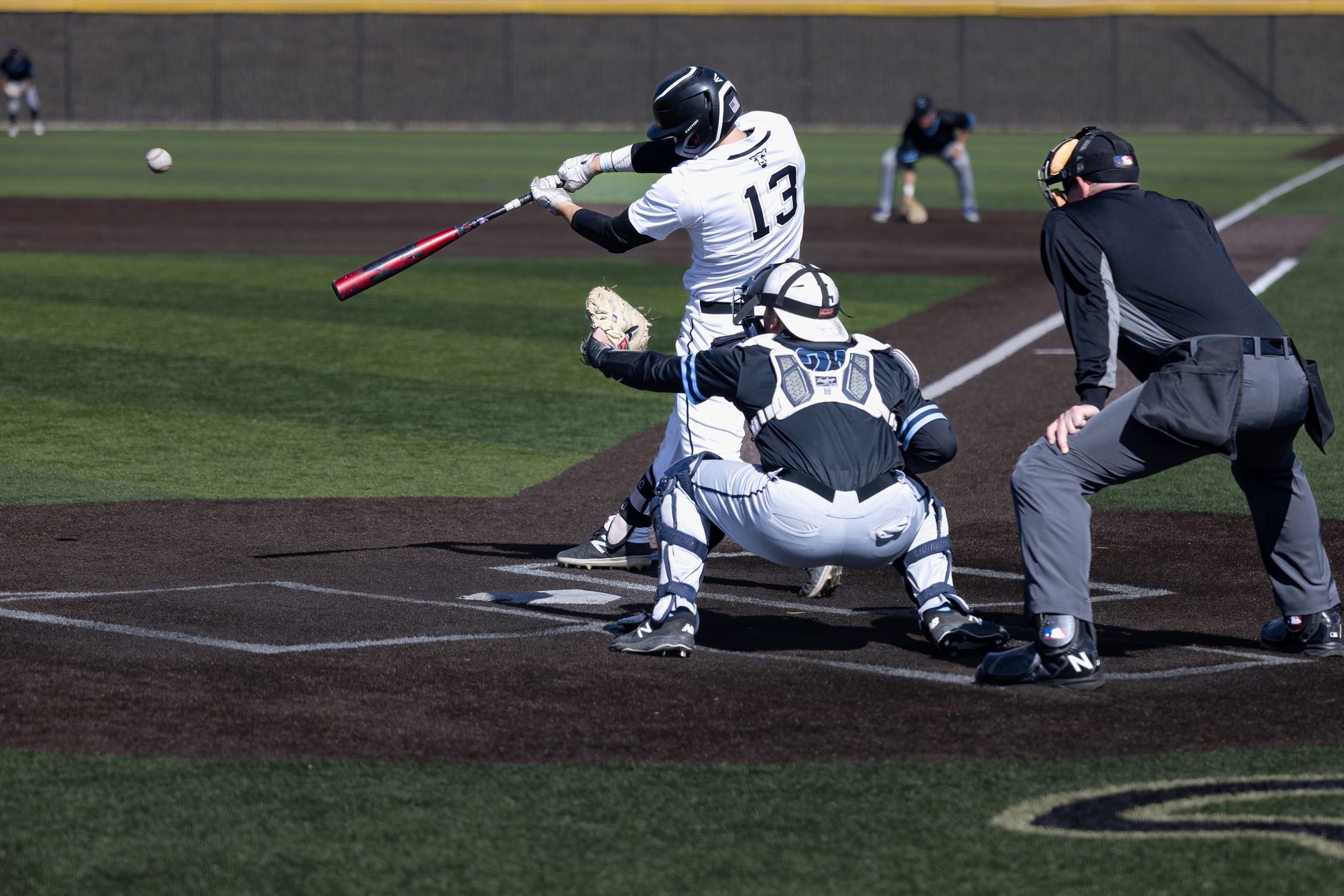 NCAA Baseball photo featuring A thrilling moment captured during a baseball game in Colorado Springs, showcasing dynamic sports action.