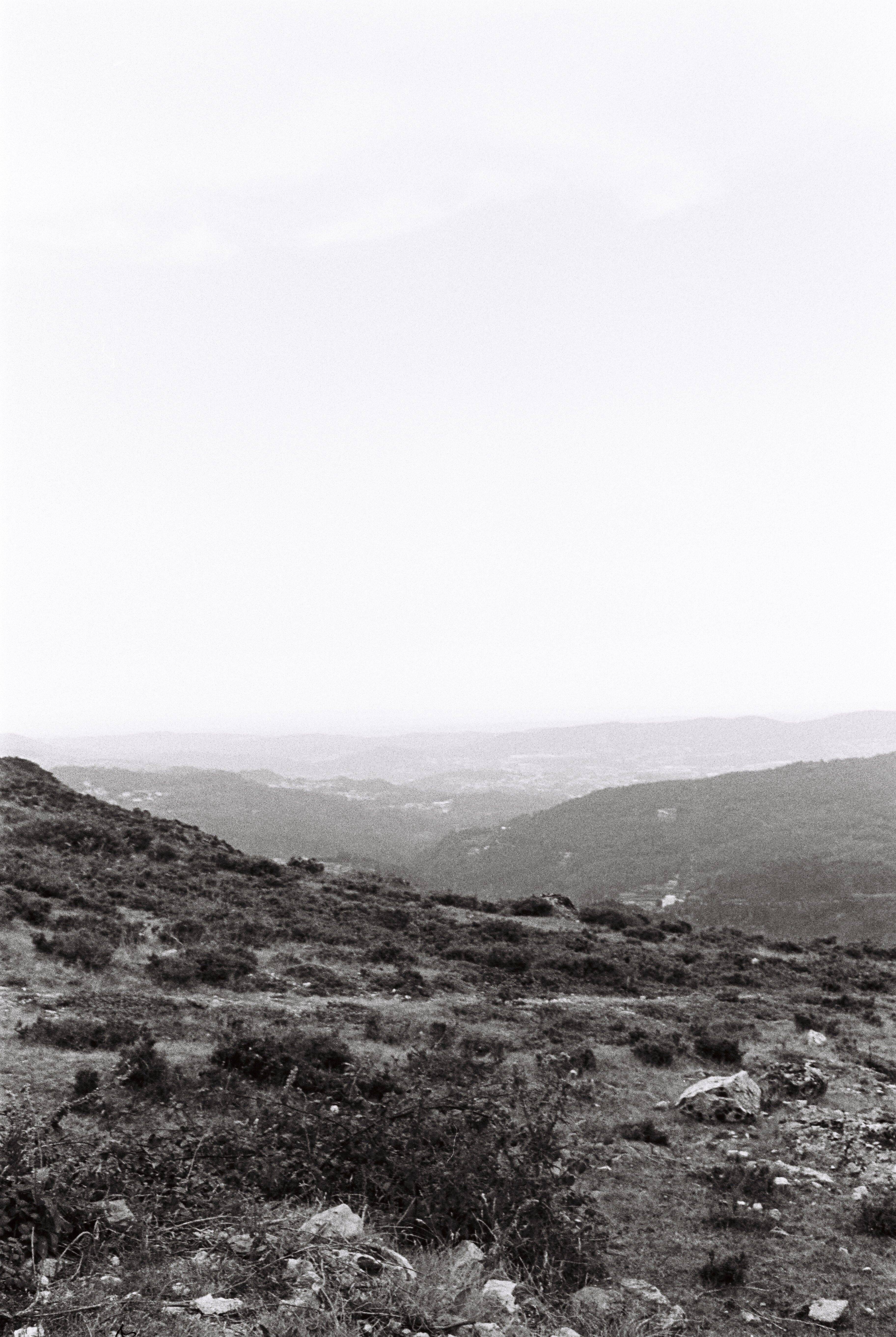 Black and white photograph of a mountainous landscape showcasing natural beauty.
