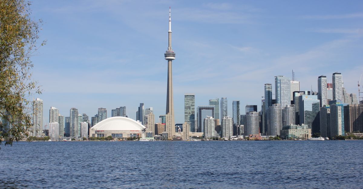 Toronto City Hall and downtown skyline reflecting the 2024 budget and property tax hike funding city services