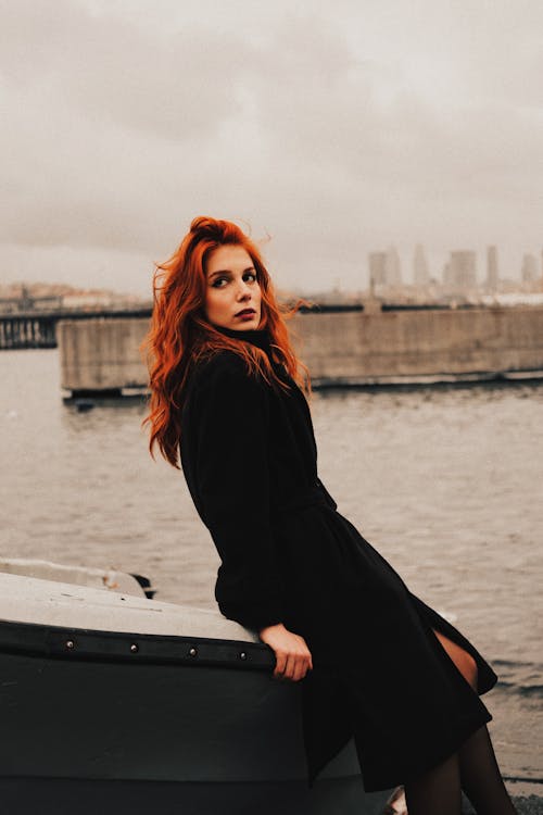 Portrait of a Woman Standing by a River