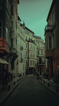 Atmospheric street view of a European alley with classic architecture, twilight setting.