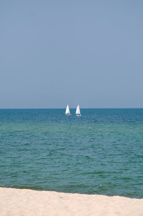Sailboats on Sea near Horizon