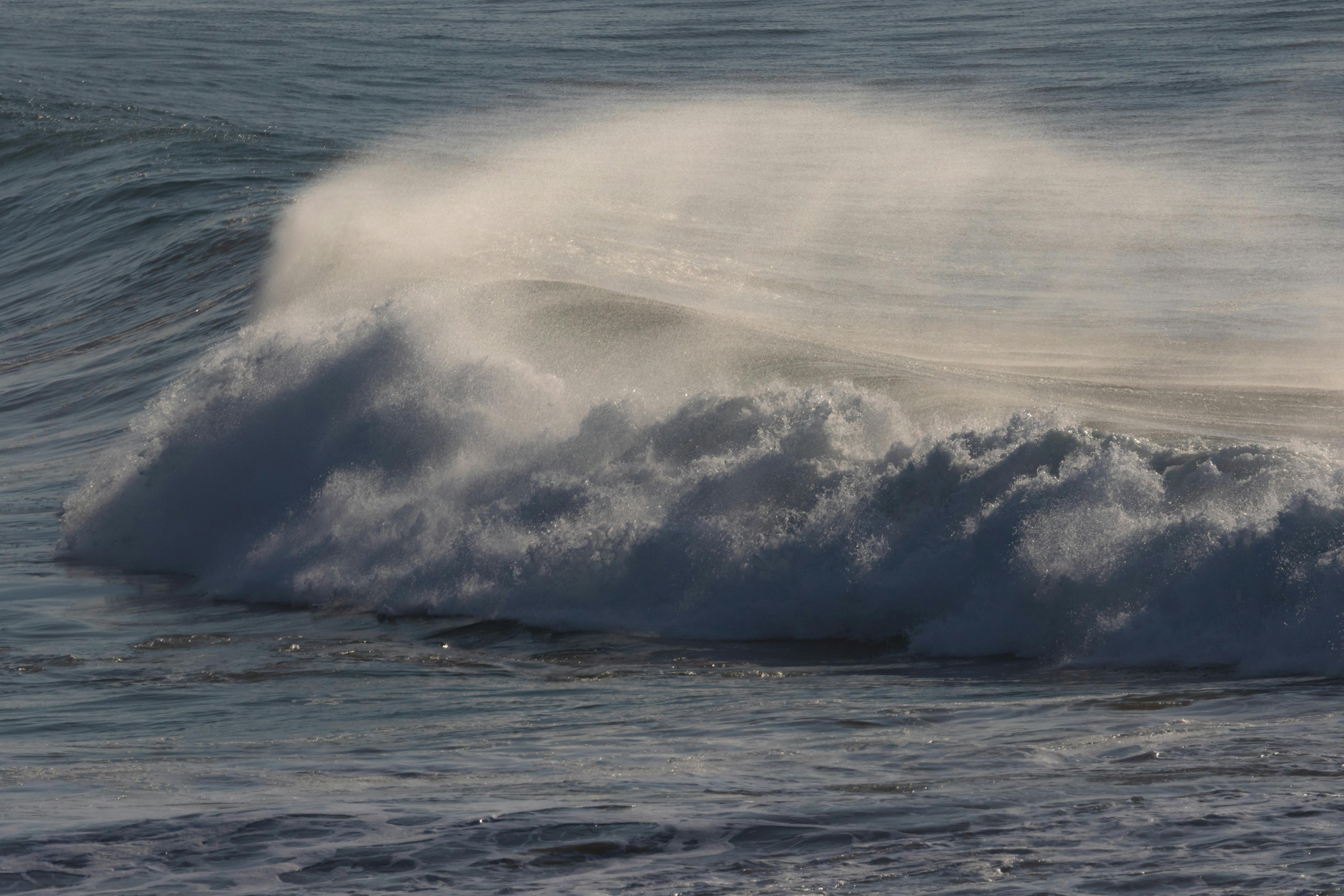 Couple in bed, bodies intertwined with messy sheets and intimate embrace