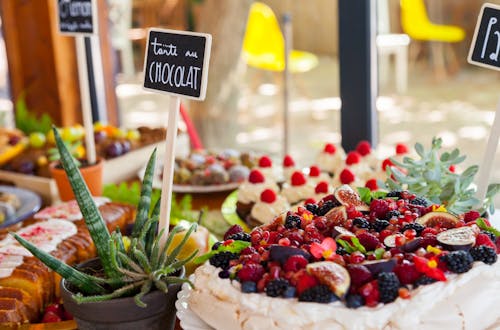 Free Dessert Table Packed with Fruity Sweets Stock Photo