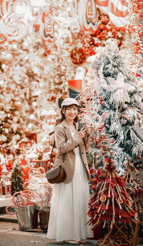 Smiling Woman near Christmas Tree