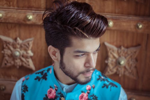 Close-Up Photo of Man Wearing Floral Top