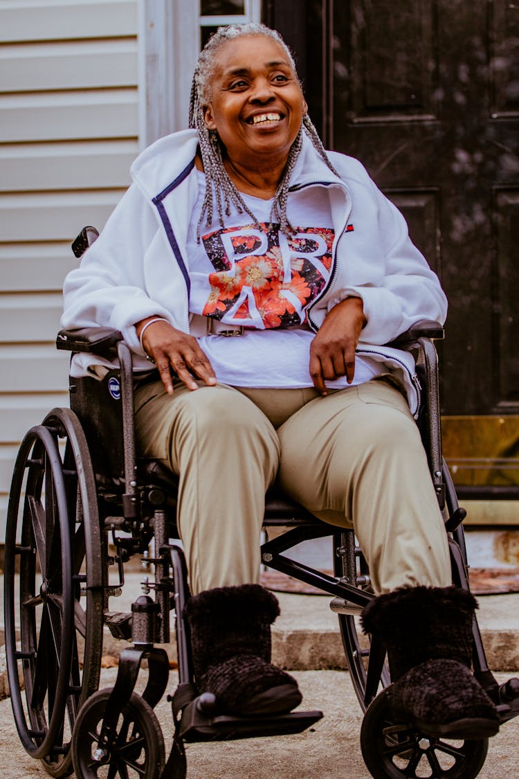 Smiling Woman On Wheelchair