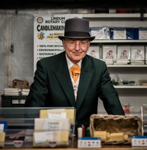 Man in Hat and Suit in Store