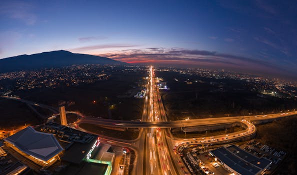A breathtaking aerial cityscape of Sofia, Bulgaria, showcasing its vibrant streets at twilight.