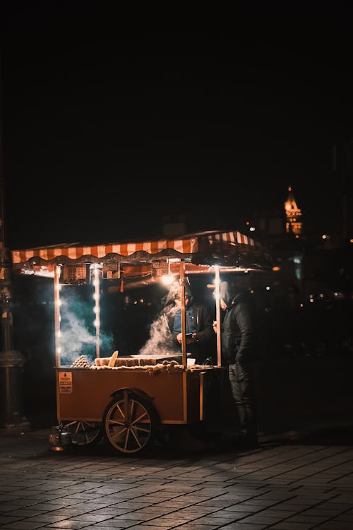 A Vendor Selling Food at Night