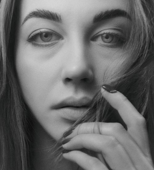 Free Black and white close-up portrait of a woman's face with a serene expression. Stock Photo