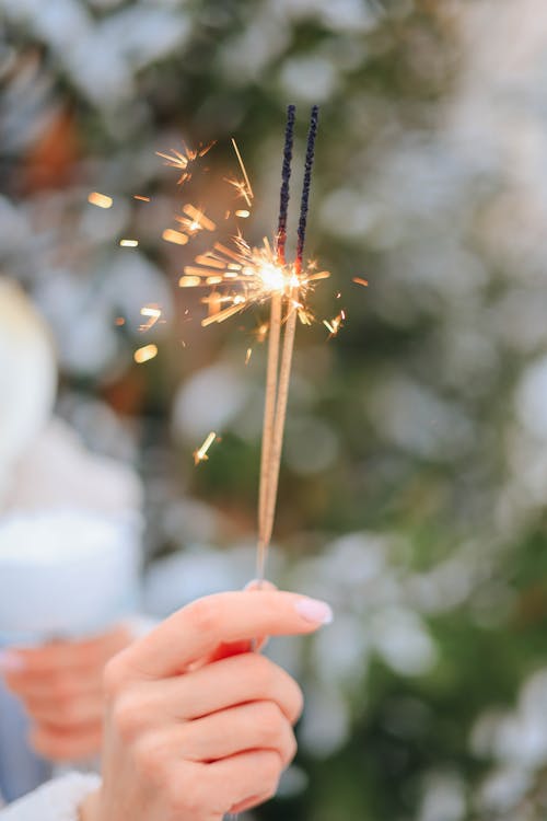 Person Holding Sparklers