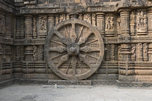 Wheel and Sculptures on the Wall of the Konark Sun Temple, Puri, Odisha, India