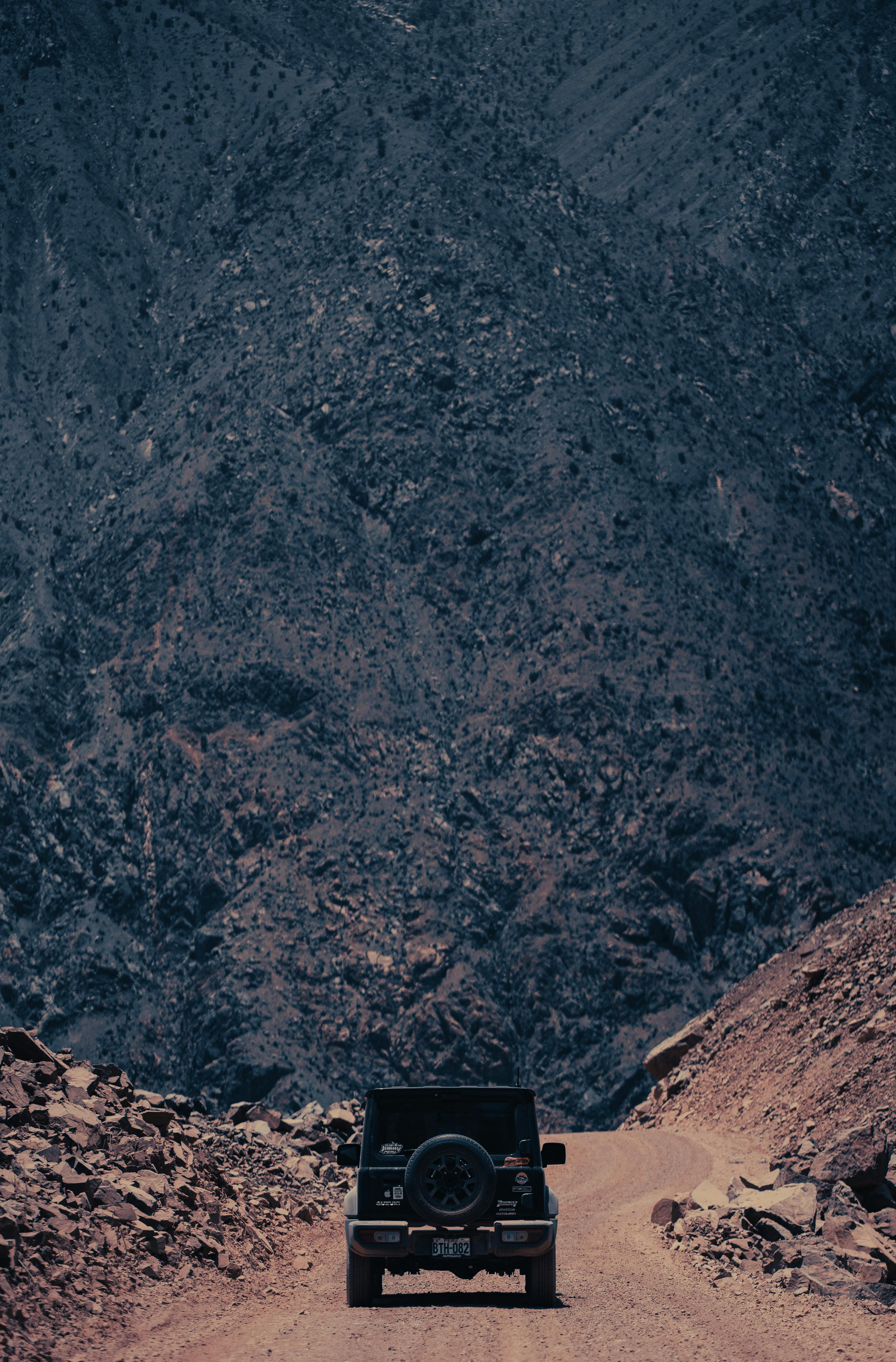 Explore the rugged dirt roads of Huarochiri, Peru, with a Suzuki Jimny, capturing the essence of adventure.