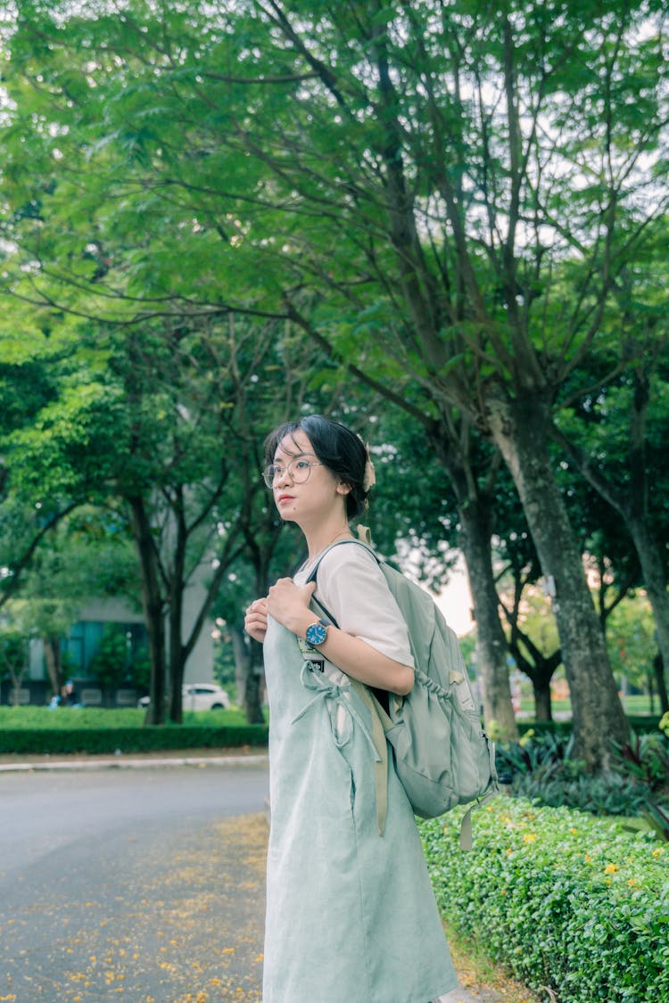 Teenage Girl Carrying A Backpack