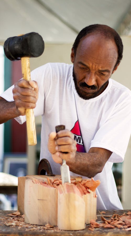 Man Holding Chisel and Mallet