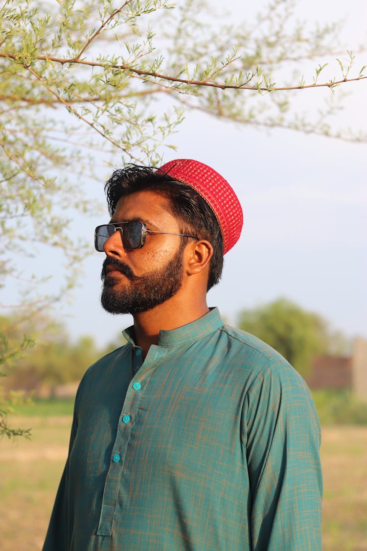 Man Wearing A Red Skullcap