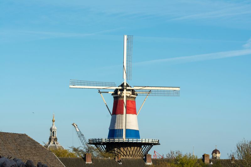 The historic Molen de Valk windmill overlooking the canals of Leiden