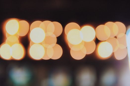 A colorful array of circular bokeh lights creating an abstract soft focus background.