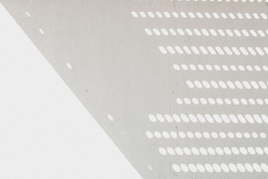 Shadow on Textured Wall · Free Stock Photo