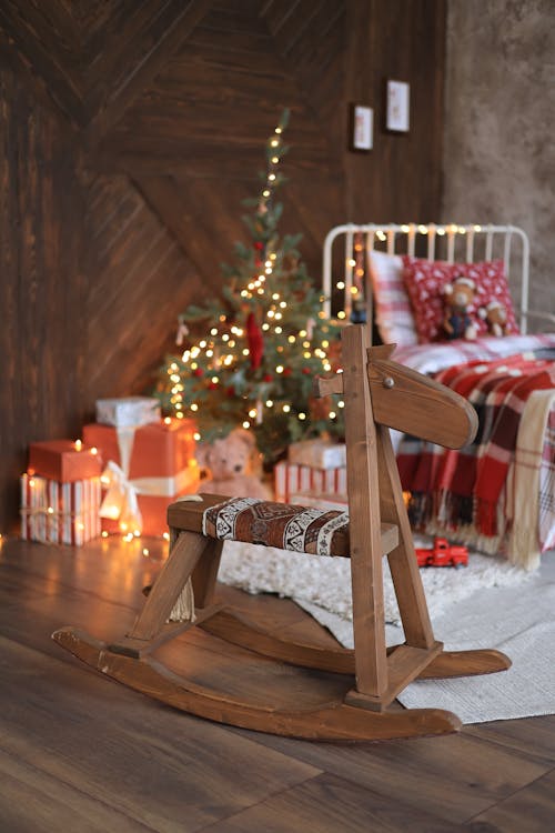 A Wooden Rocking Horse in a Room Decorated for Christmas