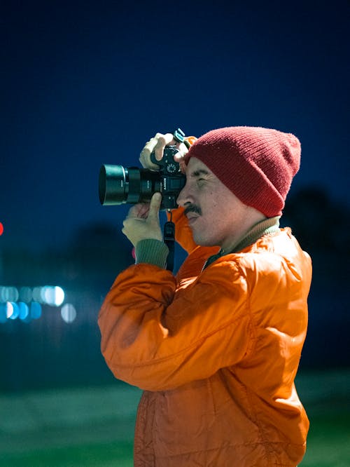 Free Man Taking Photographs with his Camera  Stock Photo