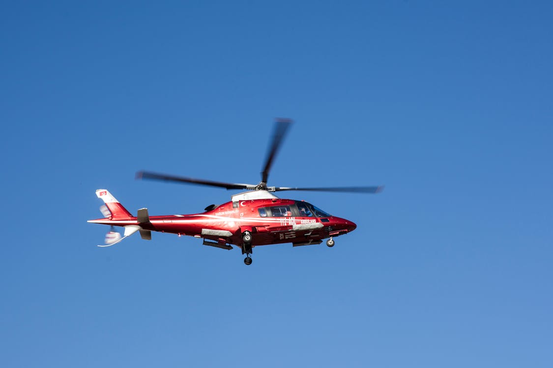 Free Flying Red and White Helicopter Stock Photo
